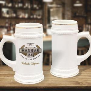 22 oz white with gold trim beer steins staged on bar