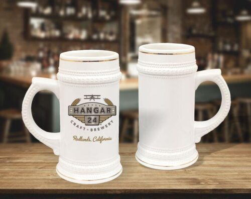 22 oz white with gold trim beer steins staged on bar